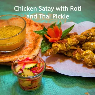 chicken satay with roti and thai pickle