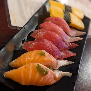 Tamago, yellowtail, tuna, and salmon belly nigiri