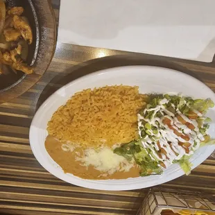 Rice, refried beans and salad