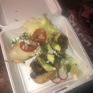 a meal in a styrofoam container