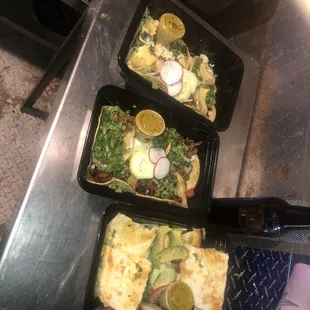 two trays of food on a table