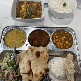 Lamb lunch platter with Rogan Josh + 2 vegetable sides (chick pea and lentil). Aloo Gobi + rice.