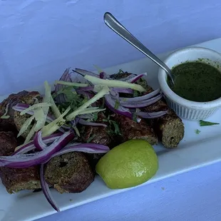 a plate of meat and vegetables