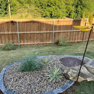 Disguising the sewer lid on the middle of my yard