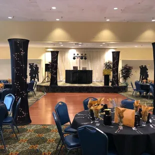 a banquet room with a stage and a stage set up