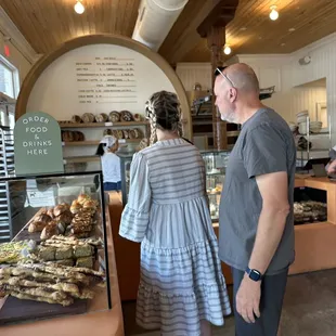a man and a woman in a bakery