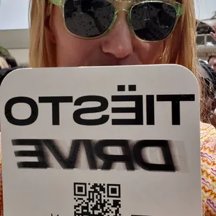 a woman holding a sign