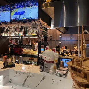 a bar with a cat statue