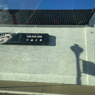 AYY Mama side of building