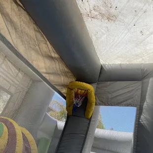 Inside and top of bounce house full of dirt and filthy.