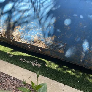 Dirt on bounce house and falling off into yard.