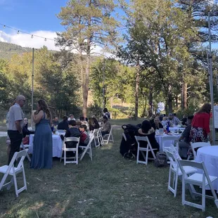 Chairs, Tables, Linens and dance floor in left background.