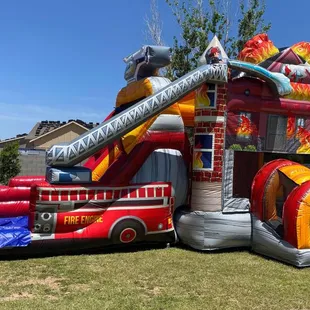Firehouse Double Slide Bounce House Rental! This Firehouse Bounce House with an Inflatable Double Slide and Basketball hoop w...