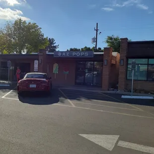 a red car parked in a parking lot