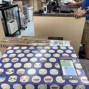 Laptop &amp; Monitors packaged ready to go...smiley face box so poetic for the madness I left...