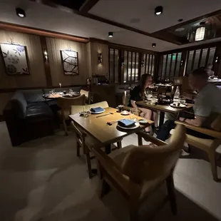 a restaurant with people sitting at tables