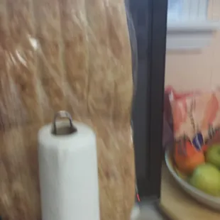 That shows how large it is. That is full size paper towel on a rack!