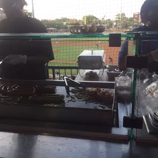 a man and a woman preparing food