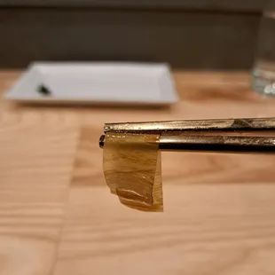 Close-up of White Kombu, which tops the Shima Aji special nigiri (striped jack). It's sweet and chewy.