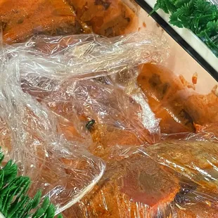 A dead fly in the marinated meat.