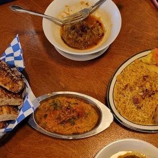 (From top, clockwise): kofteh Tabrizi, turmeric jindori chicken rice, mirza ghasemi, house bread