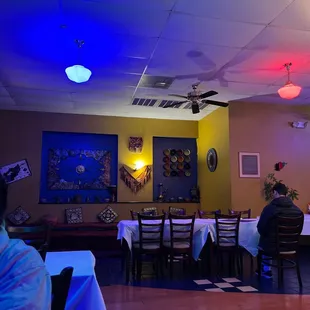 a man sitting at a table in a restaurant