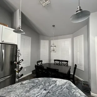 Wood shutter for kitchen in Oro Valley Arizona. Options inlcude: color pure white, standard tilt bar,  Split in the middle, 3 1/2" louver.