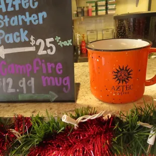 a coffee mug and a sign for campfire