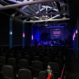 a stage with chairs and a clock