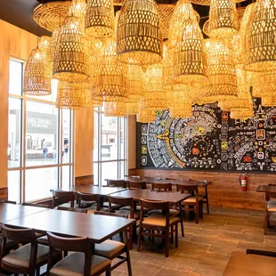 a dining area with tables and chairs
