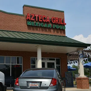 a car parked in front of a mexican food restaurant