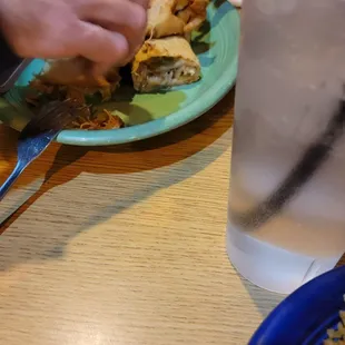 a plate of food and a glass of water
