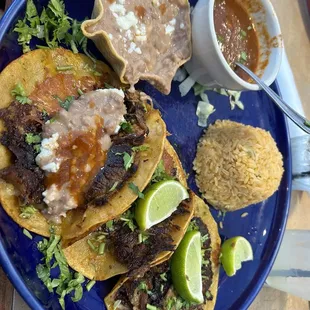 Tacos de Birria  They were okay. Rice was a little burnt tasting. Birria broth was good.
