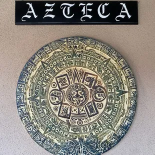 a sign on the wall of a building