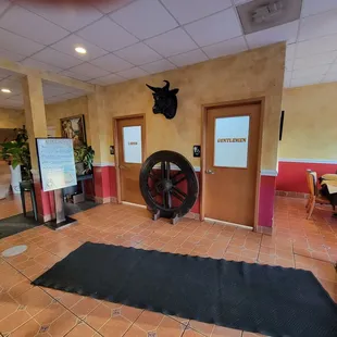 The restrooms are near the front door.