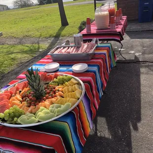 Fruit platter churros and agua Frescas