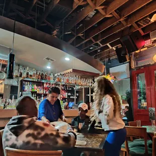 people sitting at a bar