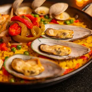 Paella - Chorizo, Shrimp, Mussels, Clams, Saffron rice, Bell Pepper Salad