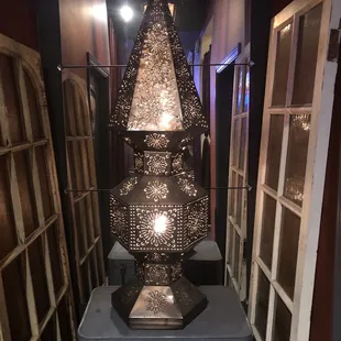 a lamp in the middle of a hallway