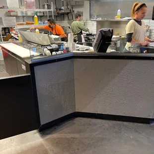 a woman working in a restaurant kitchen
