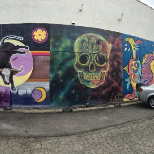 The mural on the side of the building by several artists! We just finished the left section today