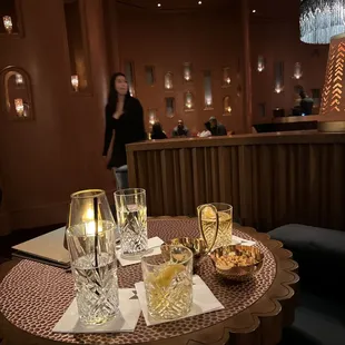 a table with wine glasses and food on it