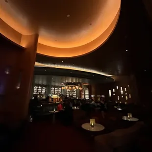 a dimly lit lounge area in a hotel
