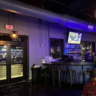 people sitting at a bar