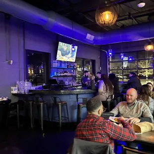 people sitting at a bar