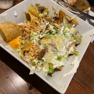 a plate of mexican food on a table