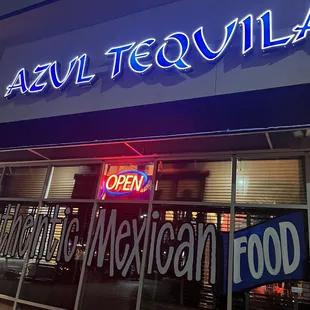 a neon sign for a mexican food restaurant