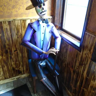 A life sized skeleton by the south entry door.