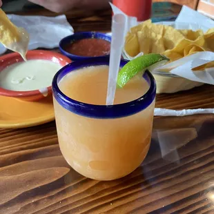 Peach margarita, cheese dip and chips and salsa.