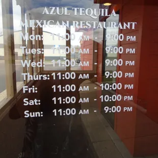 Hours of operation, front entry door.